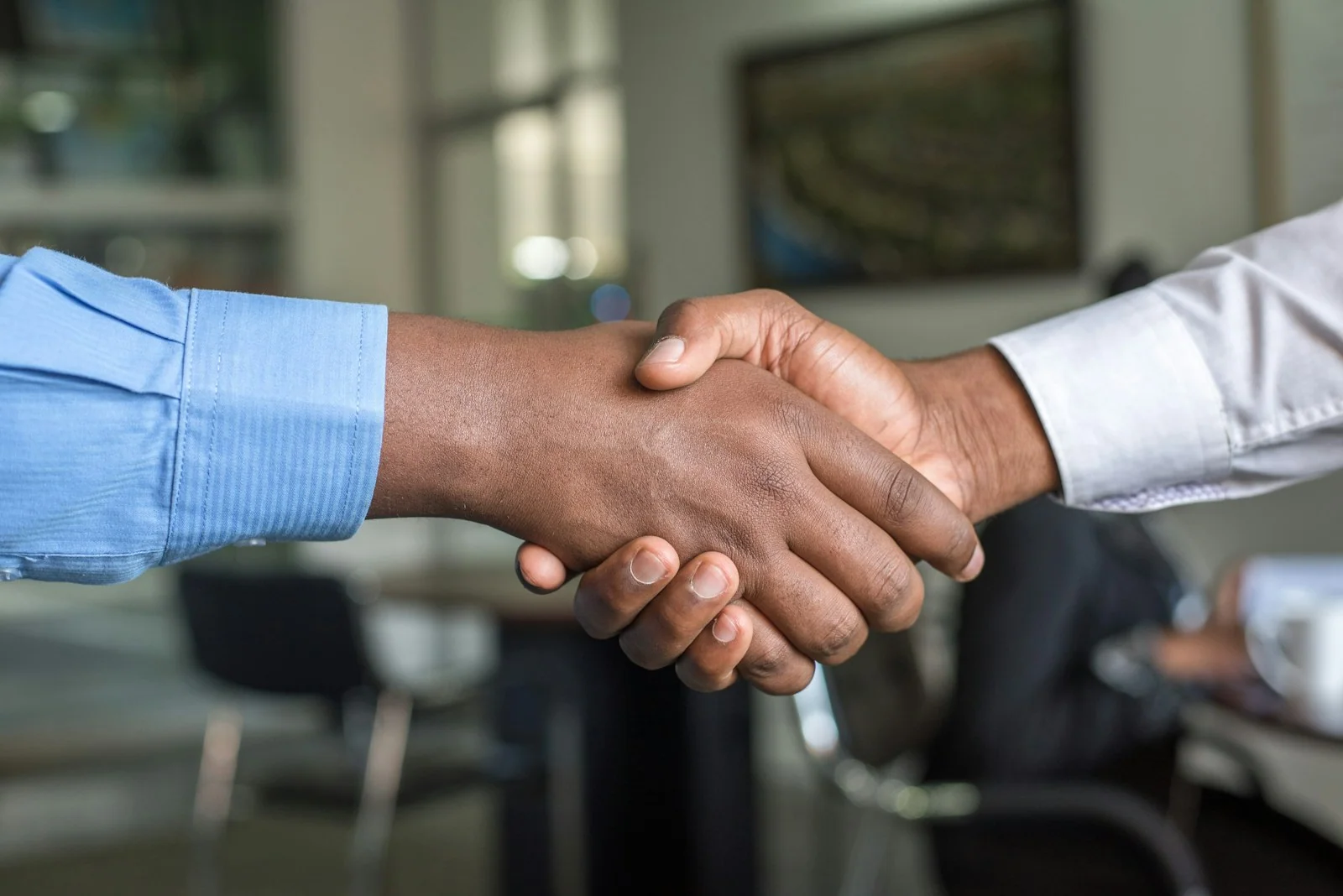 Recruiter welcoming a candidate with a handshake